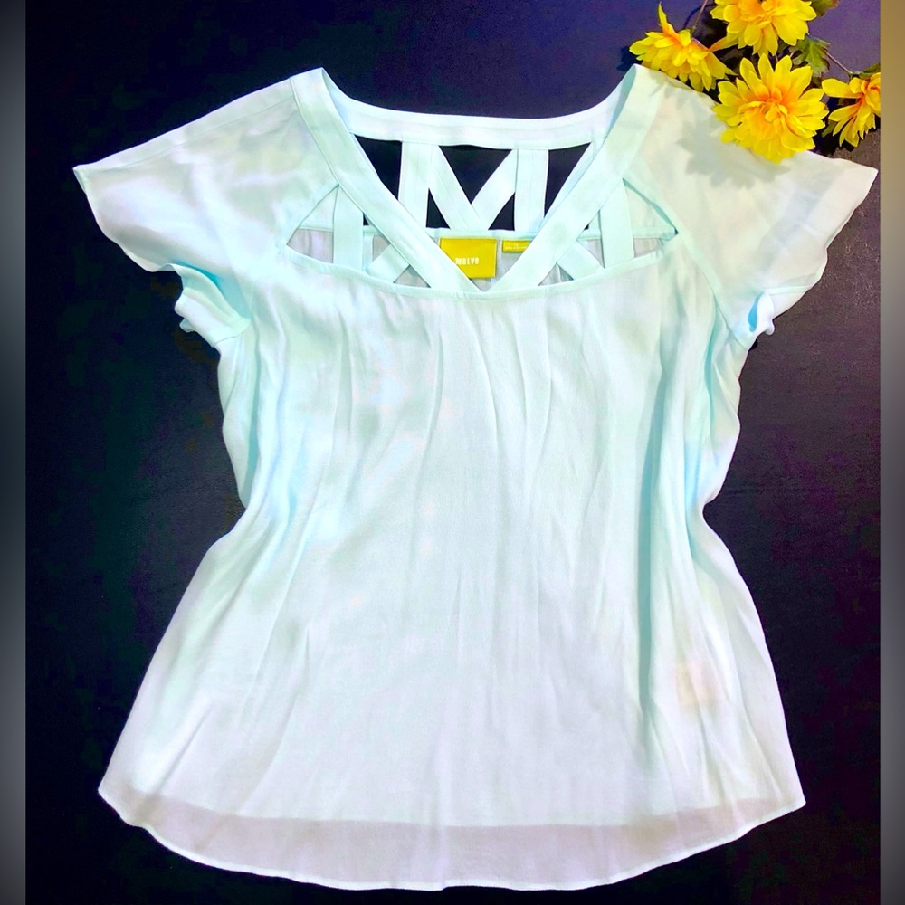 Anthropologie Maeve Light blue teal short sleeve cut out blouse size 12